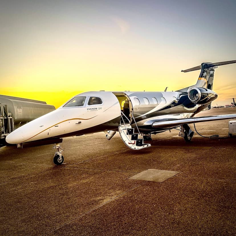 Embraer Phenom 300 with door open at sunset