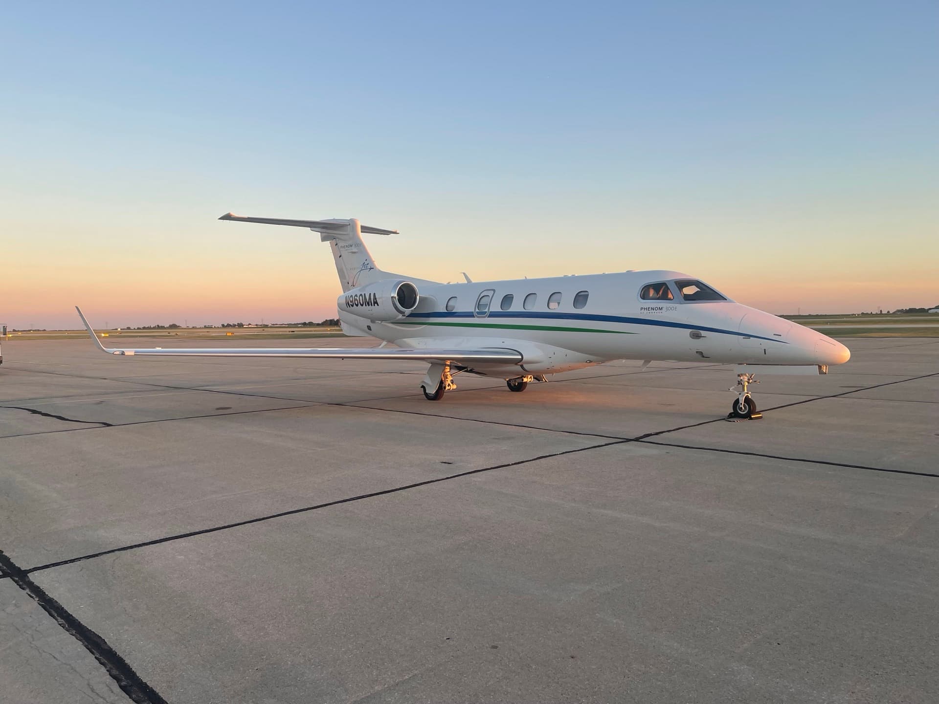 Embraer Phenom 300 on the ramp at golden hour